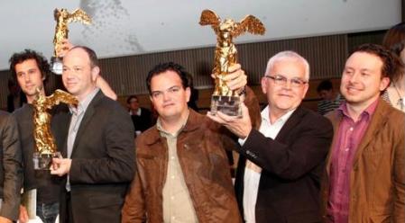 Gabriel Jaime Vanegas Montoya and Alvaro Ramirez lifts the Ars Electronica Prize