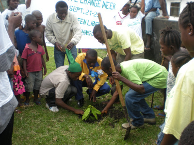 Planting a tree at Wood Camp Youth Versus Climate Change event. Photo courtesy of Saki Golafale