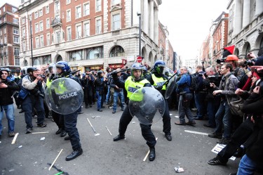 London, United Kingdom. 26th March 2011 -- photos of police in riot gear clashing with protesters at anti-cuts protest (Alex Milan Tracy)